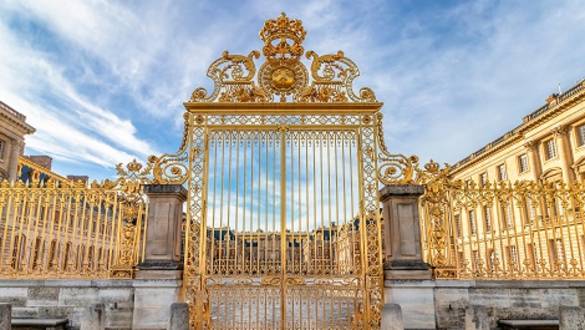 Main golden door in exterior facade of Versailles Palace, Paris, France